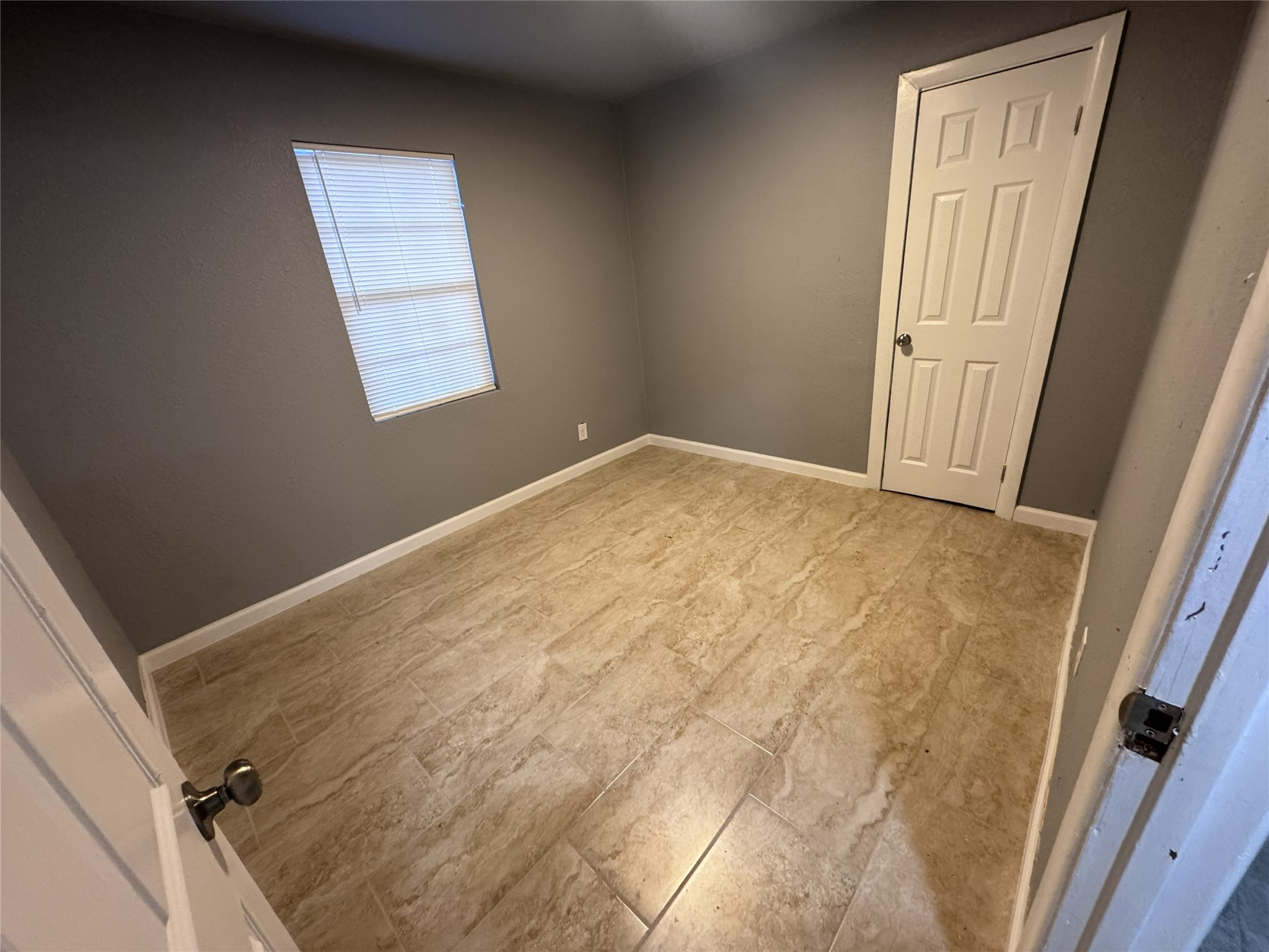 4933 Alvin Street Houston, TX 77033 - Photo 5 of 9 a view of empty room with windows