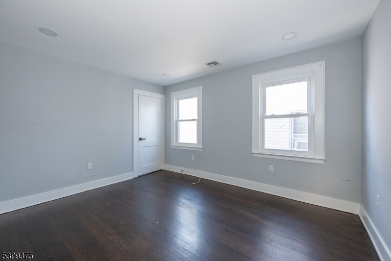 17 Peachtree Road, Unit 2 Maplewood, NJ 07040 - Photo 12 of 14 a view of an empty room with wooden floor and a window