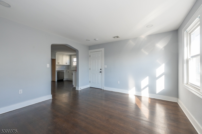 17 Peachtree Road, Unit 2 Maplewood, NJ 07040 - Photo 3 of 14 an empty room with wooden floor and windows