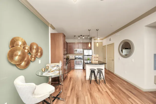 a living room with furniture or chandelier and a table