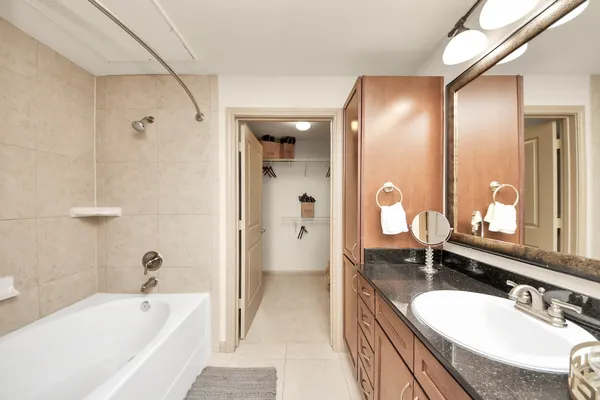 a bathroom with a sink a toilet and tub