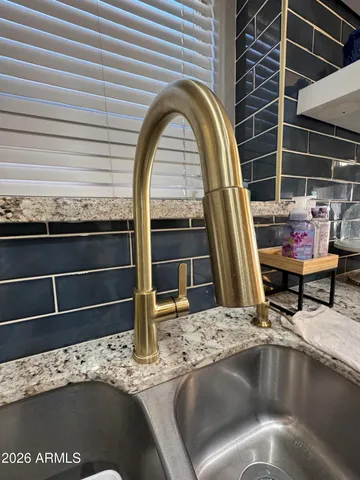 a stove top oven sitting inside of a kitchen