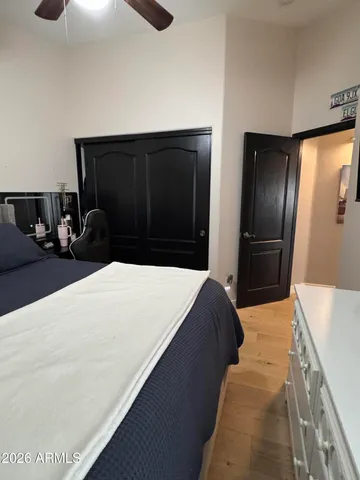 a bathroom with a granite countertop toilet sink and mirror