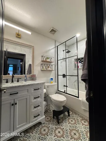 a bedroom with furniture and window