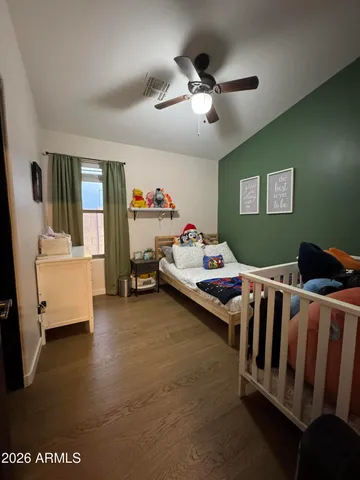 a living room with stainless steel appliances kitchen island granite countertop furniture and a view of living room