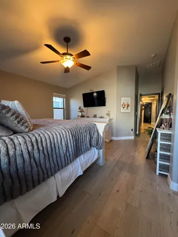 a bathroom with a sink mirror and toilet