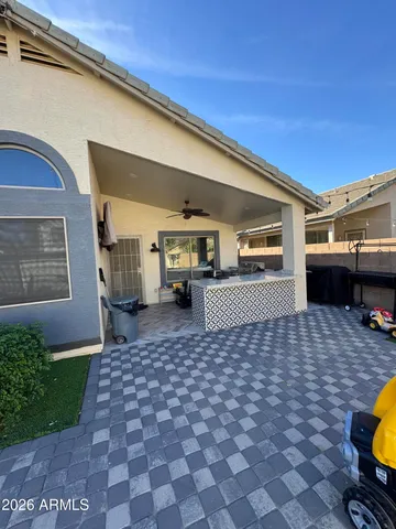 a pathway of a house with a yard