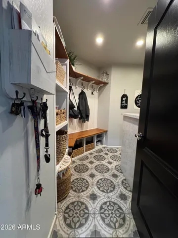 a kitchen with a sink a stove and cabinets