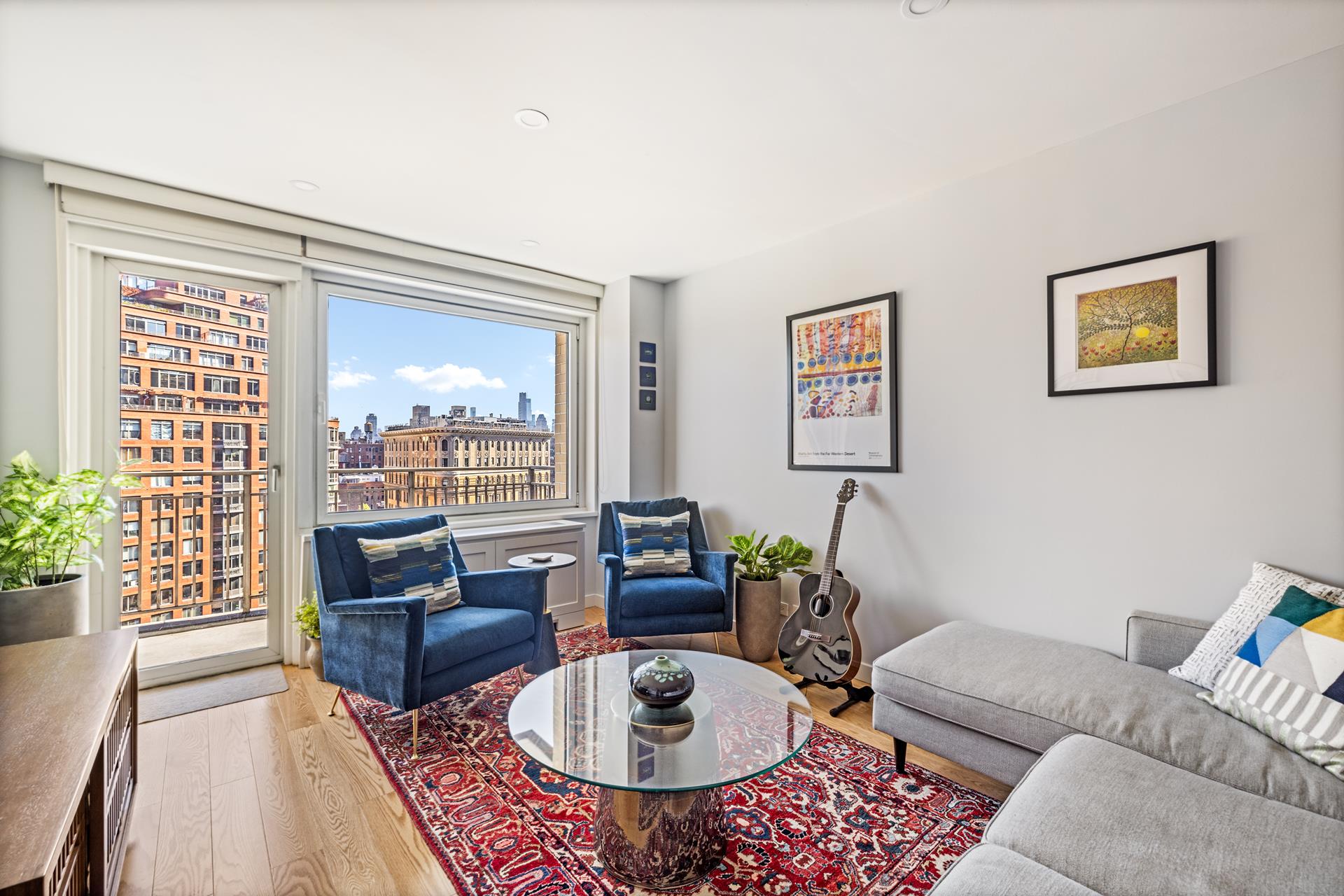 201 West 70th Street, Unit 17H Manhattan, NY 10023 - Photo 1 of 1 a living room with furniture and a window