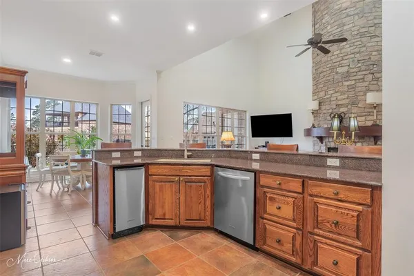 a kitchen with a sink and a stove top oven