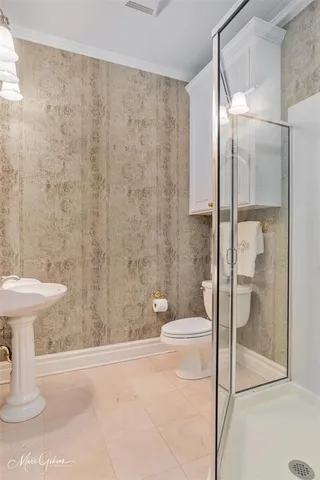 a bathroom with a shower and toilet