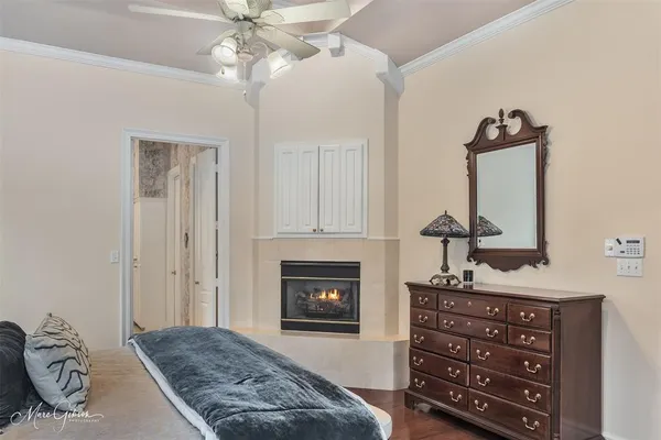 a bedroom with a bed and a fireplace