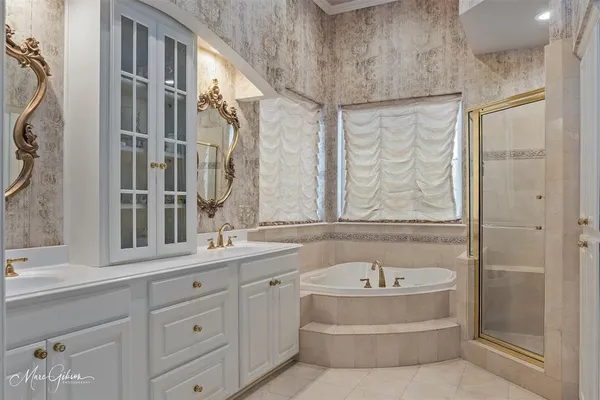 a bathroom with a bathtub and a sink