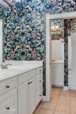 a view of a kitchen with a sink and cabinets