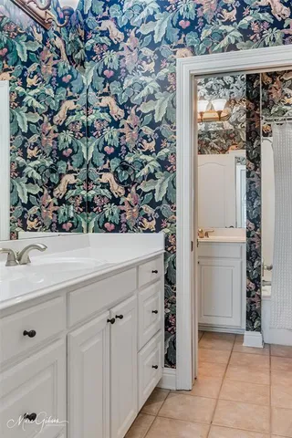 a view of a kitchen with a sink and cabinets