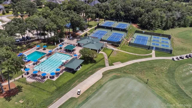 an aerial view of a house with a swimming pool