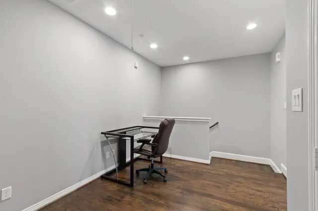 a view of workspace with wooden floor
