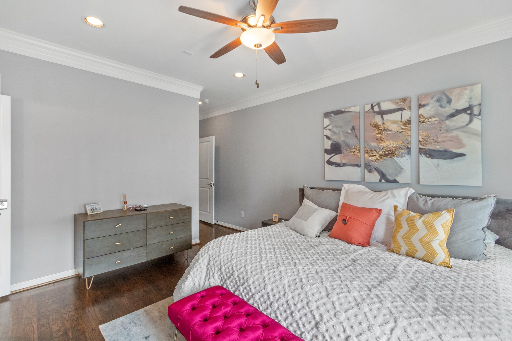 2409 Lawrence Street Houston, TX 77008 - Photo 14 of 21 a bedroom with a bed and a chandelier