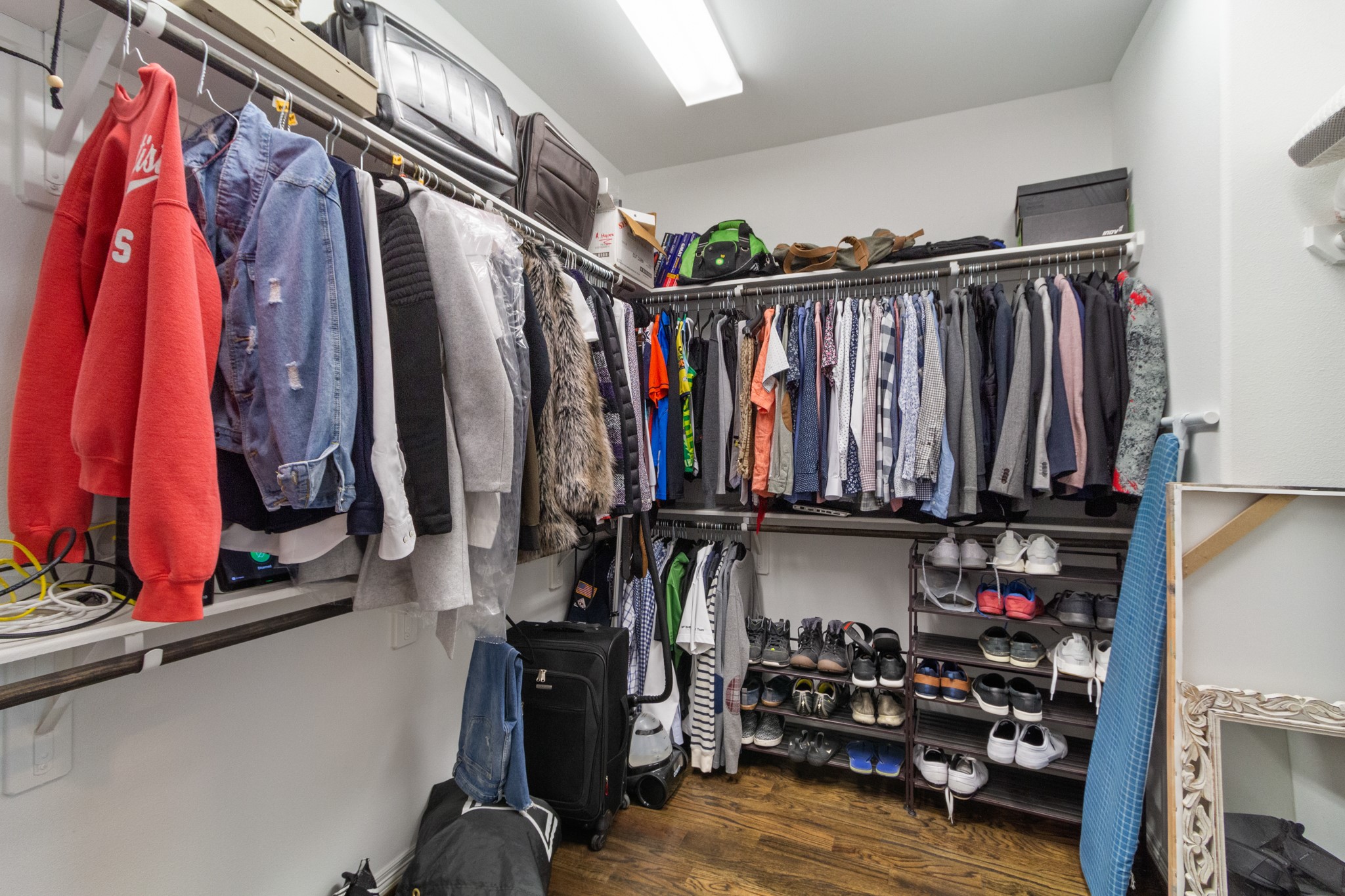 2409 Lawrence Street Houston, TX 77008 - Photo 16 of 21 a view of walk in closet with clothes and shoes