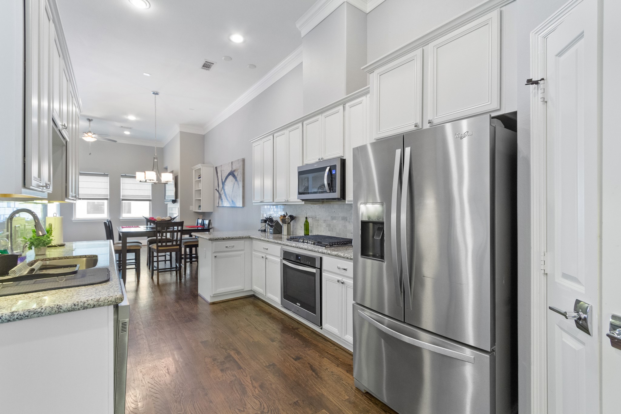2409 Lawrence Street Houston, TX 77008 - Photo 5 of 21 a kitchen with stainless steel appliances a refrigerator sink and microwave