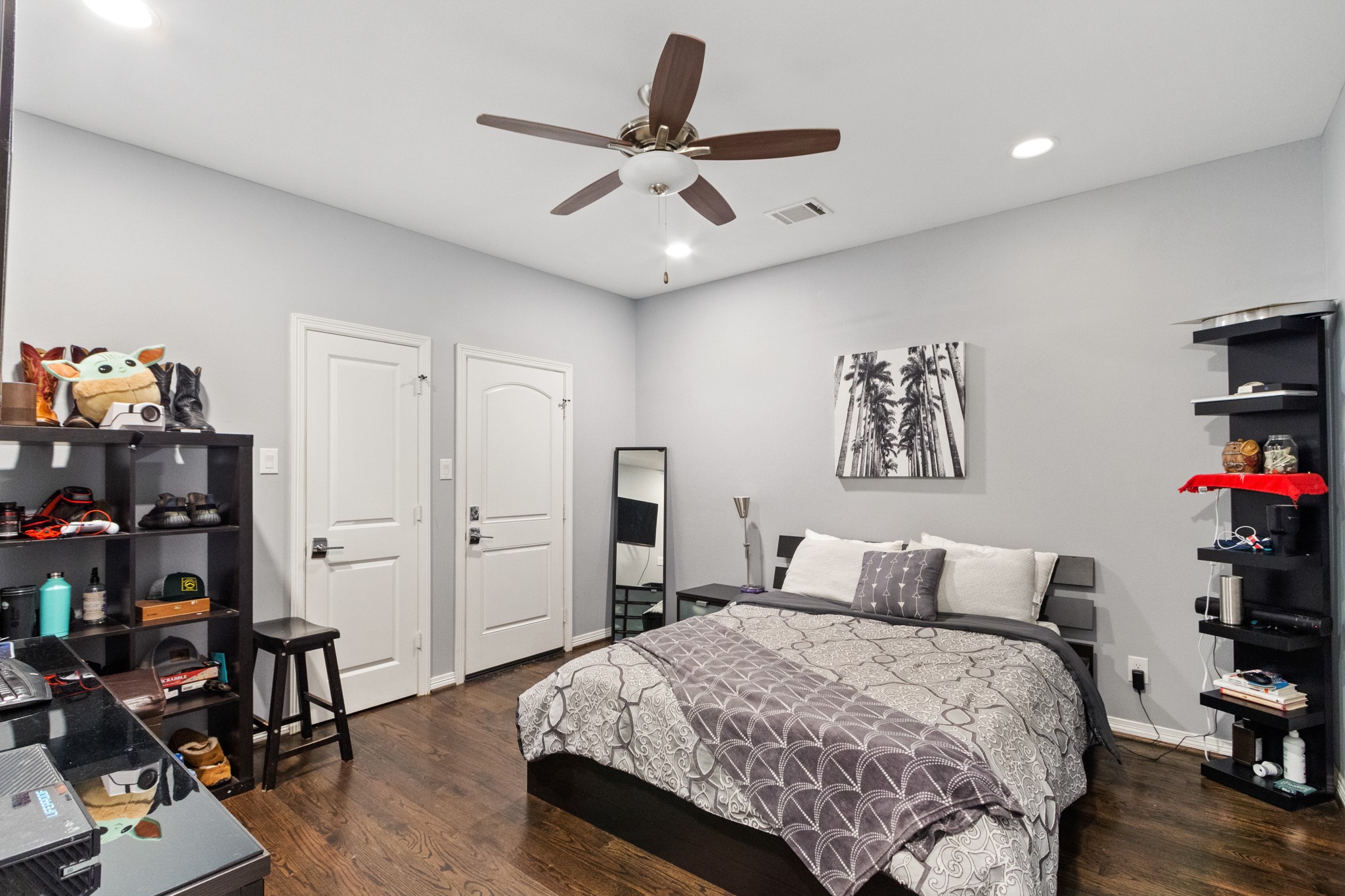 2409 Lawrence Street Houston, TX 77008 - Photo 9 of 21 a bedroom with a bed and wooden floor