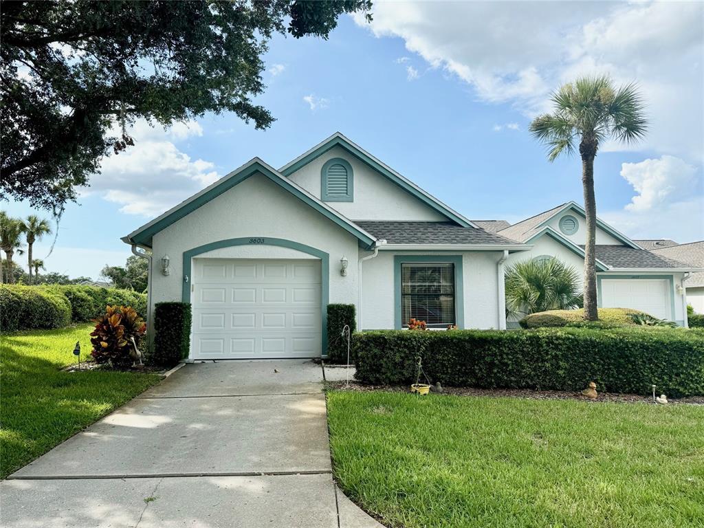 3603 Downfield Place New Port Richey, FL 34655 - Photo 1 of 1 a front view of house with yard and green space
