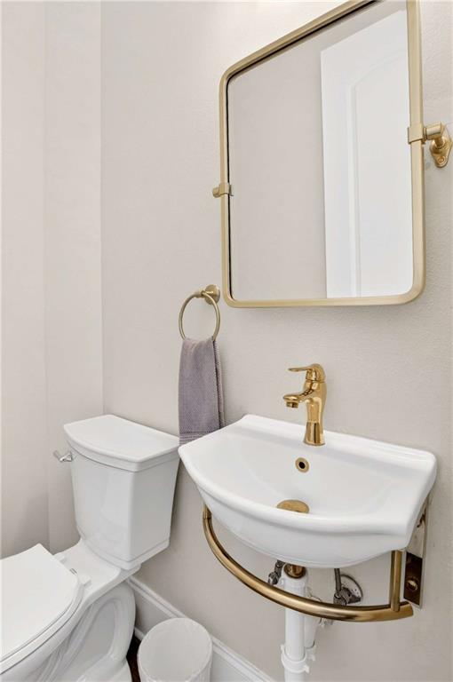 841 Inman Village Parkway Northeast Atlanta, GA 30307 - Photo 12 of 27 a bathroom with a sink and a toilet