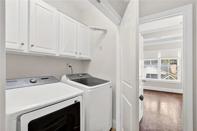 a view of storage and utility room with washer and dryer