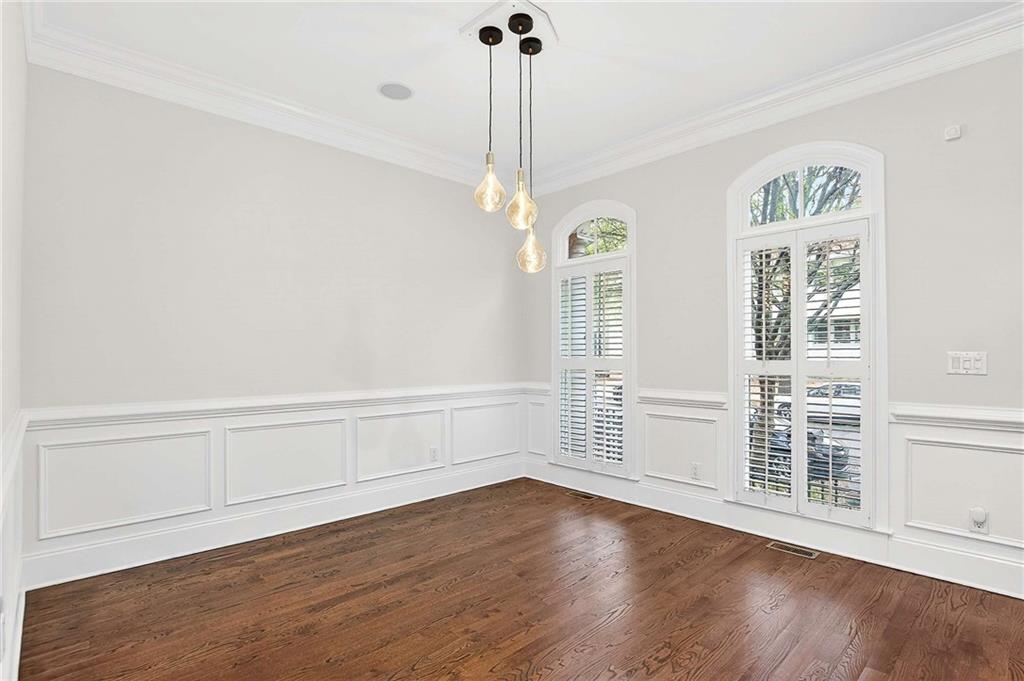 841 Inman Village Parkway Northeast Atlanta, GA 30307 - Photo 4 of 27 a view of an empty room with a window and wooden floor
