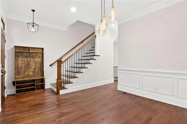 a view of entryway with wooden floor