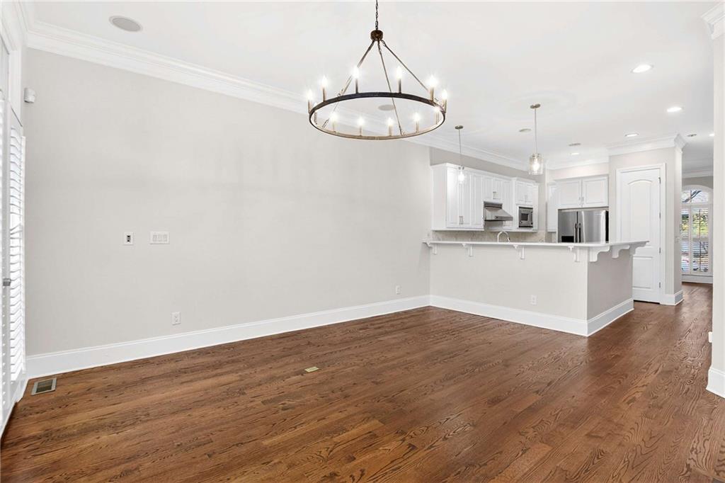 841 Inman Village Parkway Northeast Atlanta, GA 30307 - Photo 7 of 27 a view of a kitchen with a sink cabinets and wooden floor
