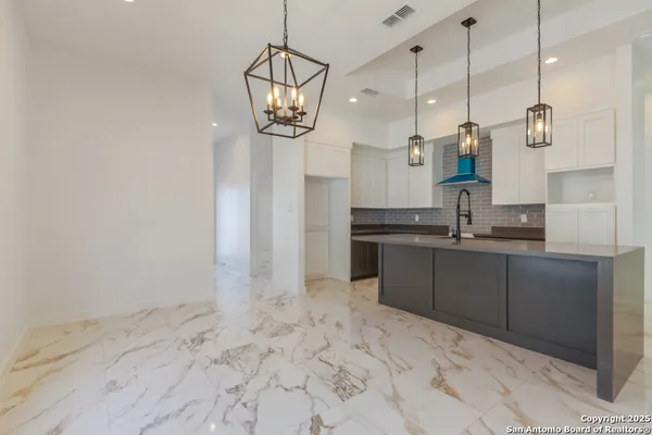 a kitchen with a sink and cabinets