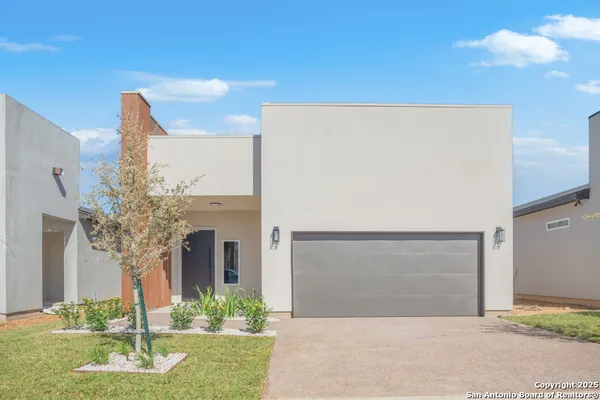 a front view of a house with yard