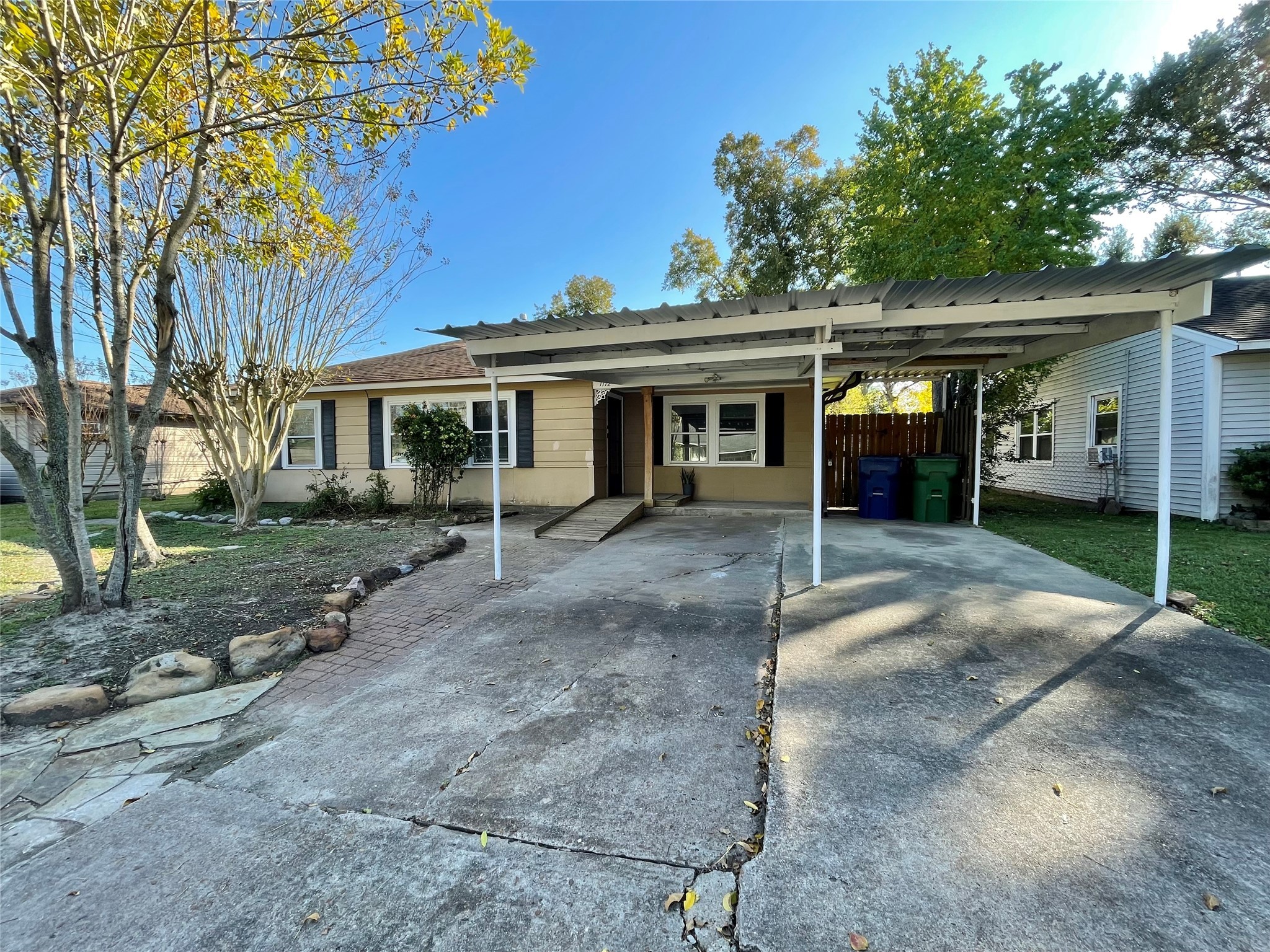 1112 Southampton Drive Angleton, TX 77515 - Photo 1 of 36 a view of a house with a yard and potted plants