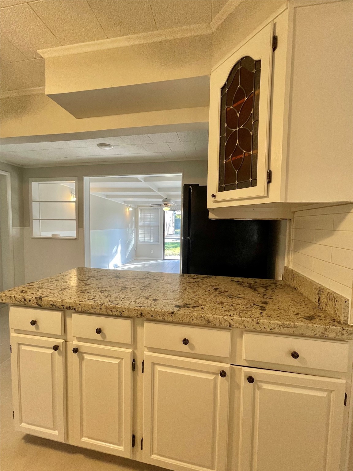 1112 Southampton Drive Angleton, TX 77515 - Photo 15 of 36 a kitchen with granite countertop granite countertop white cabinets and a granite counter tops