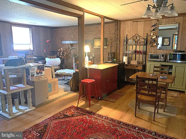 a dinning table and chairs in a patio of the house