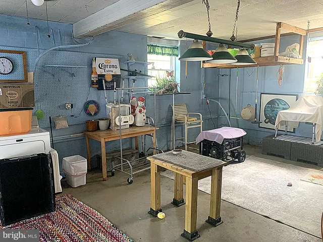 a bedroom with a bed dresser and a window