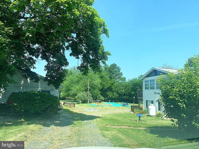 a backyard of a house with lots of green space