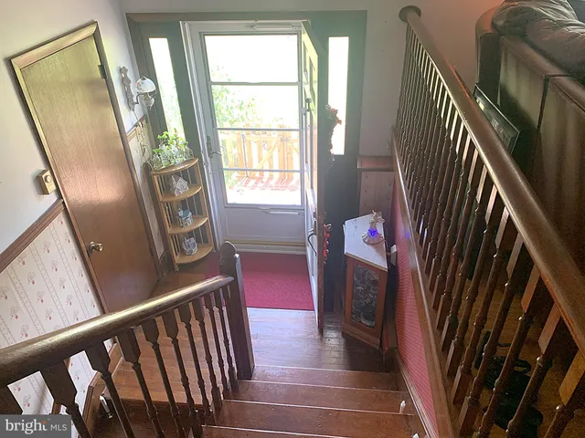 a bathroom with a toilet sink and shower curtain