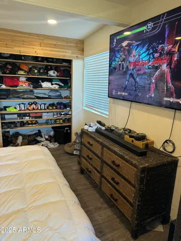 a room with furniture and a flat screen tv