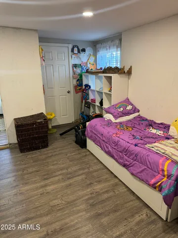 a bedroom with a bed and a closet