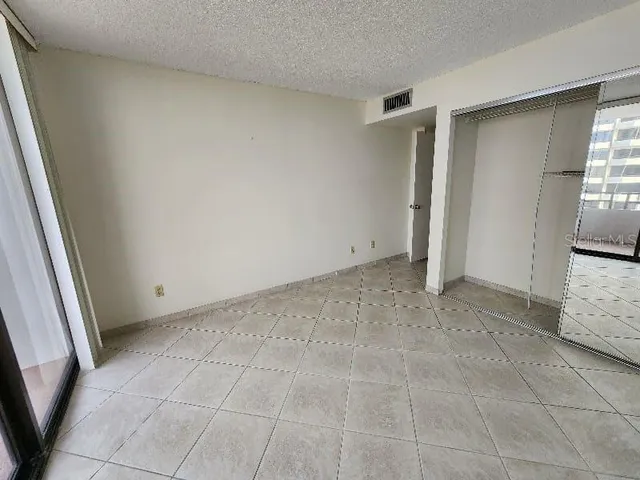 a view of an empty room and a window