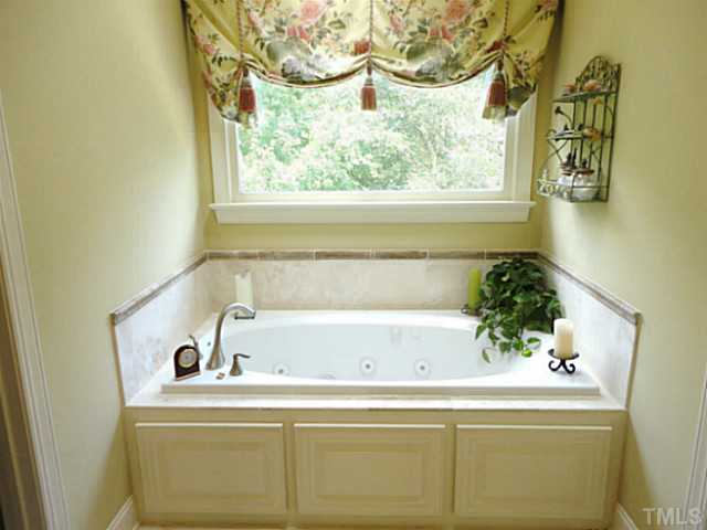 1108 Mersey Lane Raleigh, NC 27615 - Photo 14 of 25 a bathroom with a sink and a window