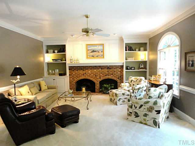 1108 Mersey Lane Raleigh, NC 27615 - Photo 4 of 25 a living room with furniture and a fireplace