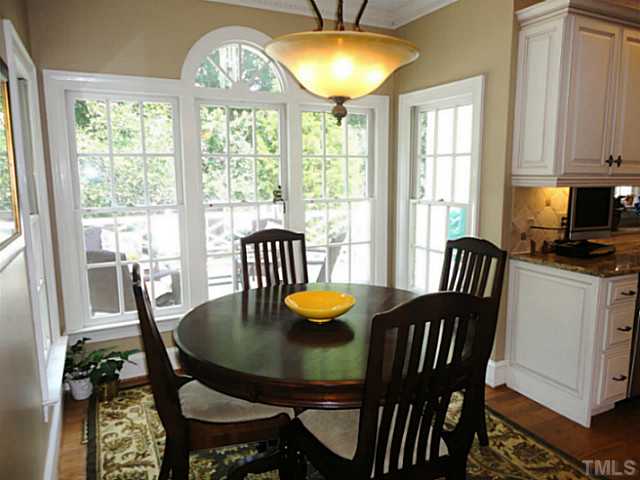 1108 Mersey Lane Raleigh, NC 27615 - Photo 9 of 25 a view of a dining room with furniture window and outside view