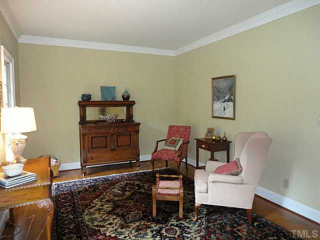 1108 Mersey Lane Raleigh, NC 27615 - Photo 10 of 25 a living room with furniture and a flat screen tv