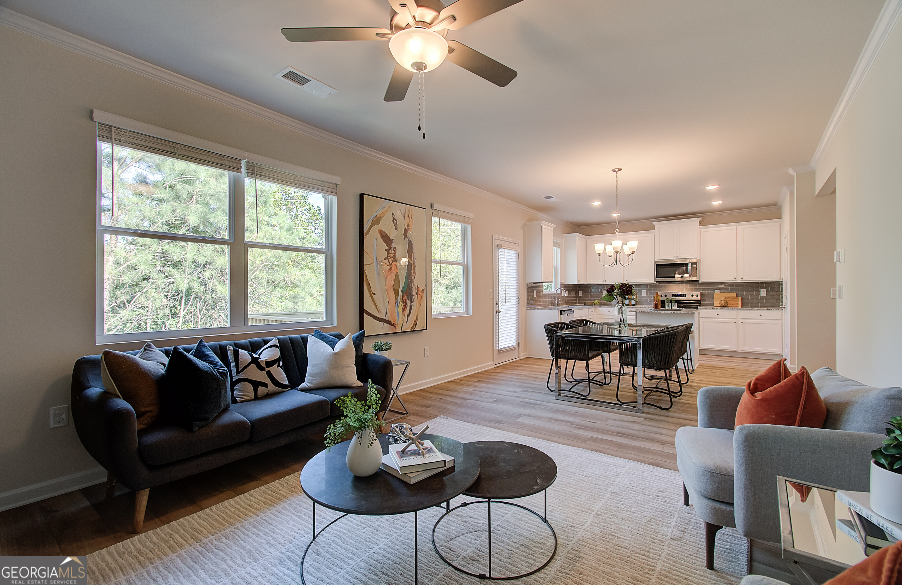 4581 Ajo Walk, Unit HOMESITE 22 Atlanta, GA 30331 - Photo 2 of 18 a living room with furniture kitchen view and a large window