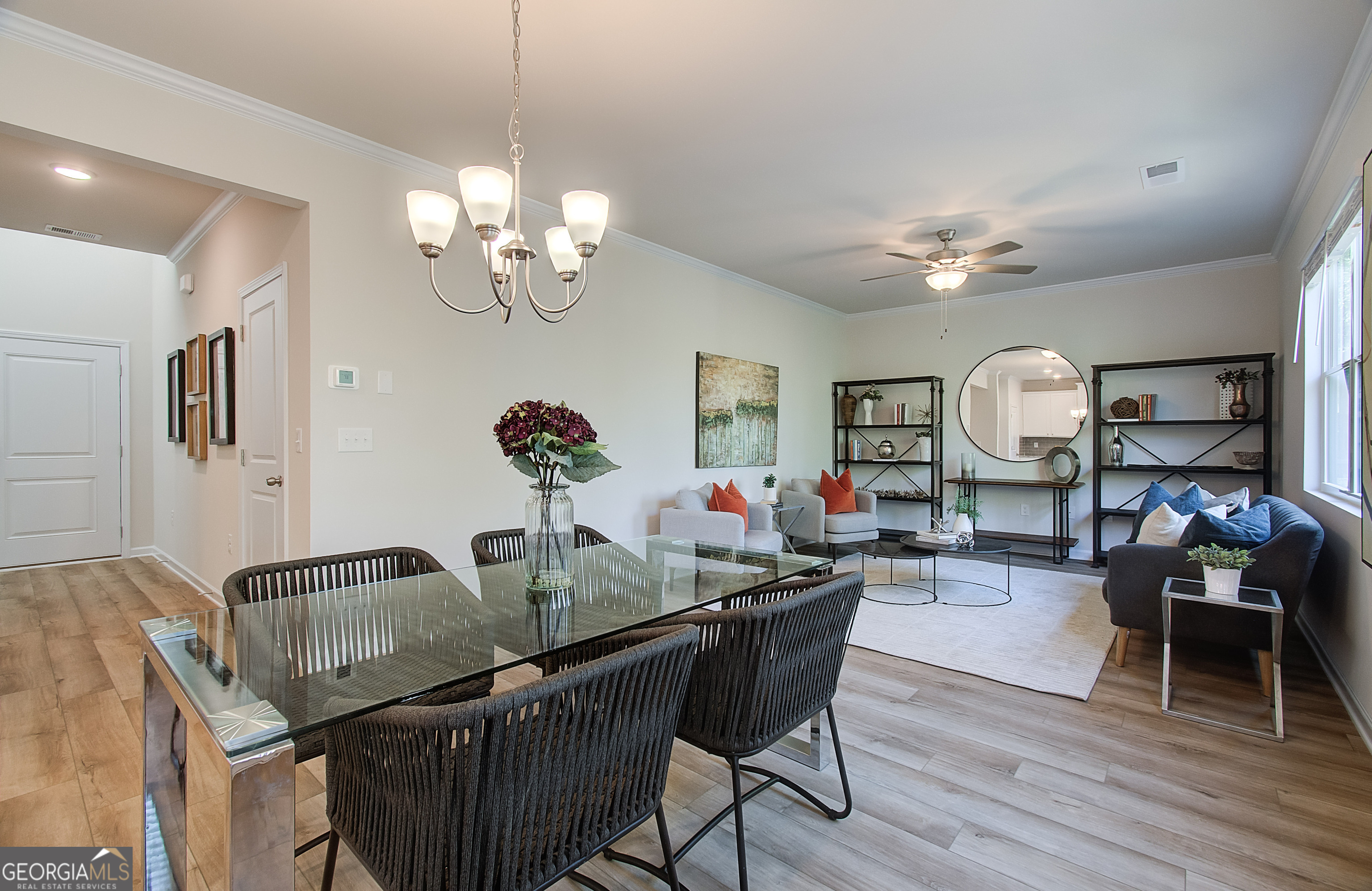 4581 Ajo Walk, Unit HOMESITE 22 Atlanta, GA 30331 - Photo 5 of 18 a view of a dining room with furniture and wooden floor