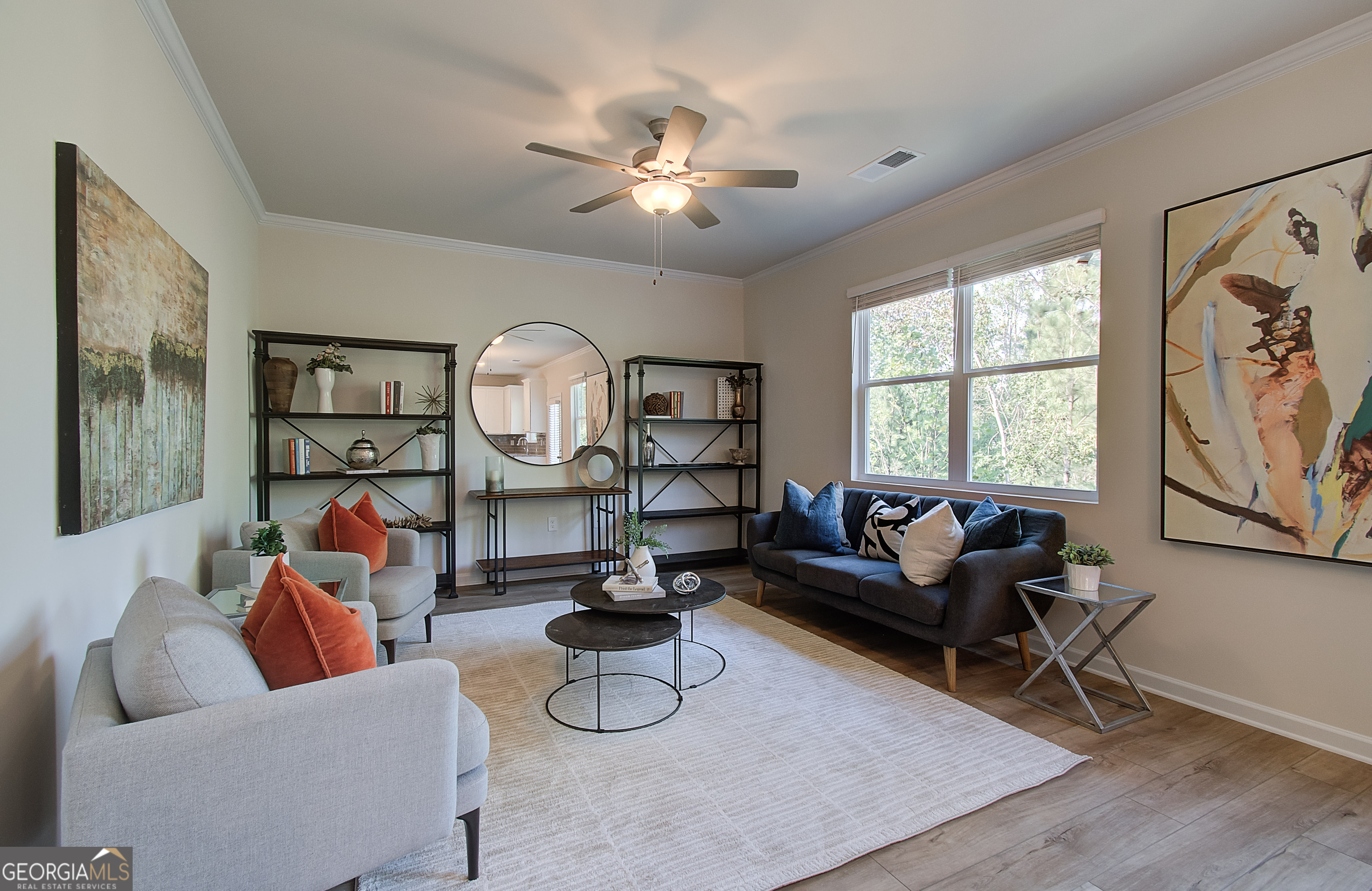 4581 Ajo Walk, Unit HOMESITE 22 Atlanta, GA 30331 - Photo 7 of 18 a living room with furniture a large window and a chandelier