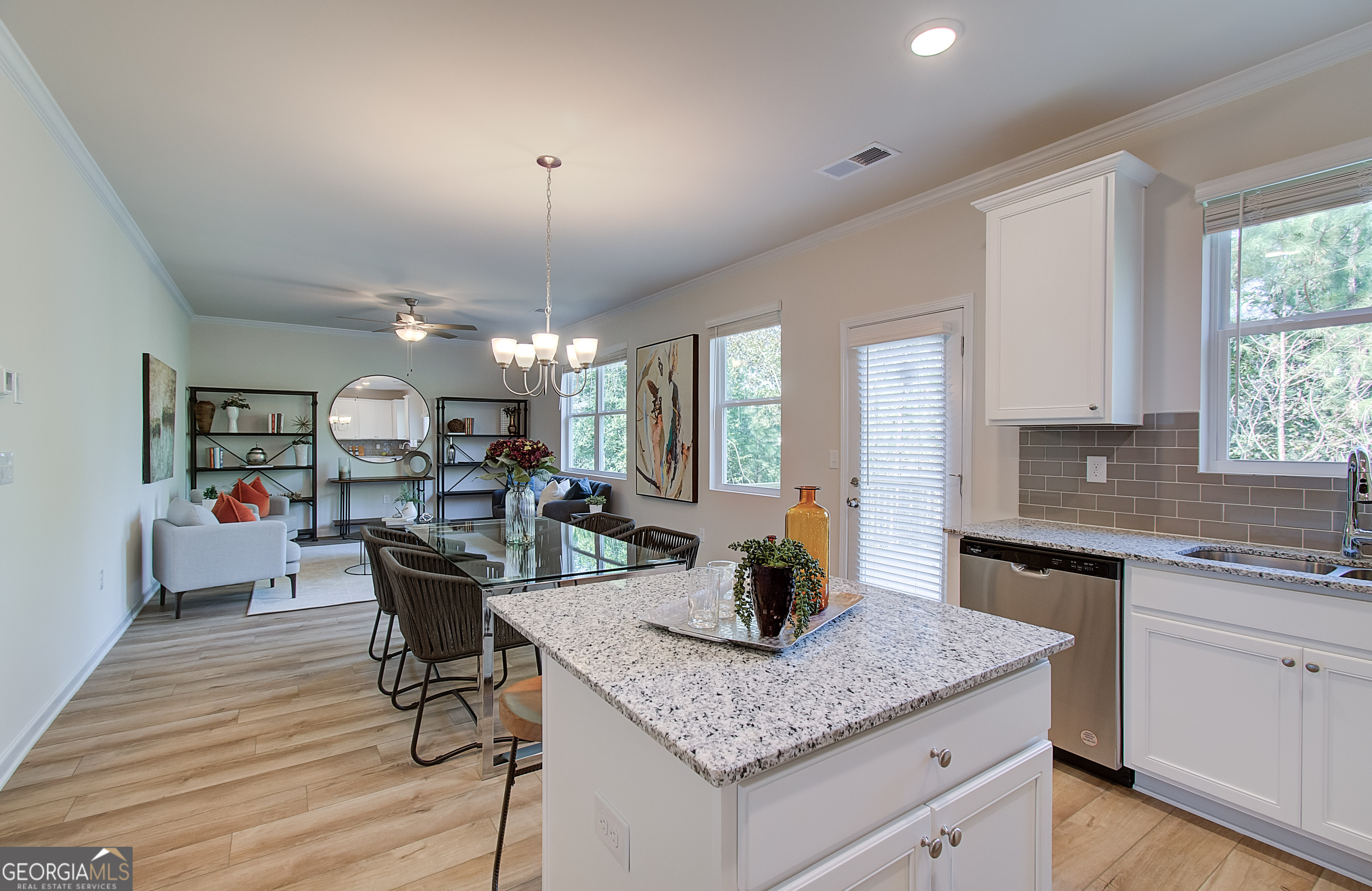 4581 Ajo Walk, Unit HOMESITE 22 Atlanta, GA 30331 - Photo 9 of 18 a kitchen with a table chairs and wooden floor